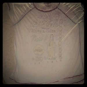 Coca-Cola shirt is see through it is red and white
